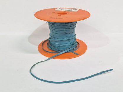 A spool of light blue leather lace wound on an orange plastic core, with a short length of the blue material draped in front, set against a plain white background.